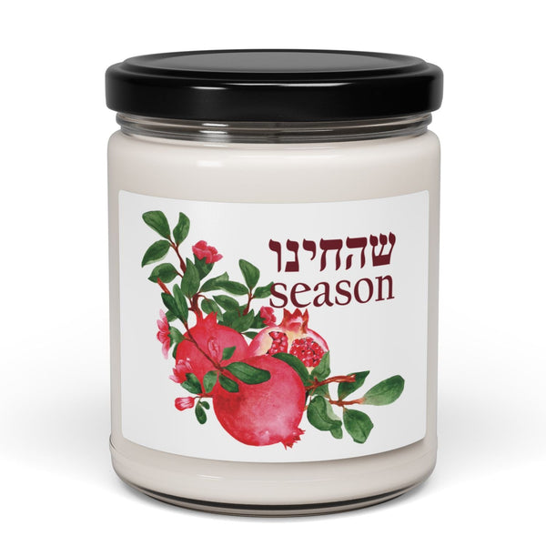 Jar with a black lid and a decorative label featuring pomegranates and Hebrew text on a white background.